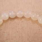Close-up of white chalcedony and orange agate bracelet with S925 silver.