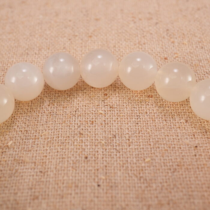 Close-up of white chalcedony and orange agate bracelet with S925 silver.