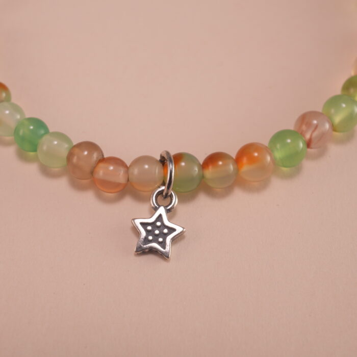Close-up of yellow and green chalcedony bracelet with silver.