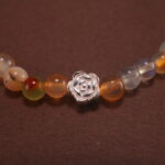 Close-up of yellow-green chalcedony bracelet with silver.