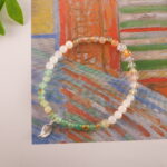 Bracelet in daylight showing soft yellow-green transparency.