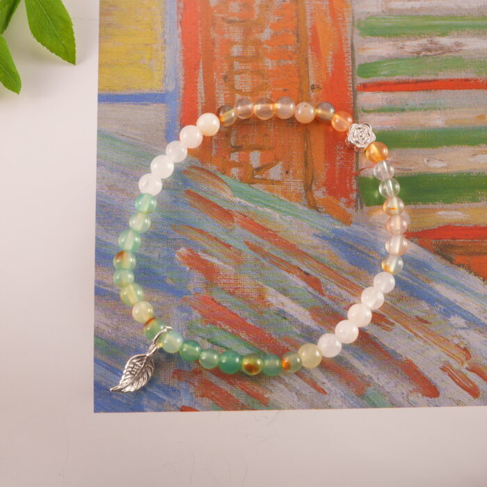 Bracelet in daylight with soft multicolor gemstone tones.