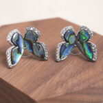 Close-up of the moonstone butterfly earring, showing delicate wing details and its dreamy sheen.