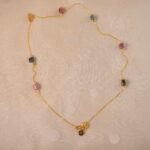 Tourmaline delicate necklace on white background
